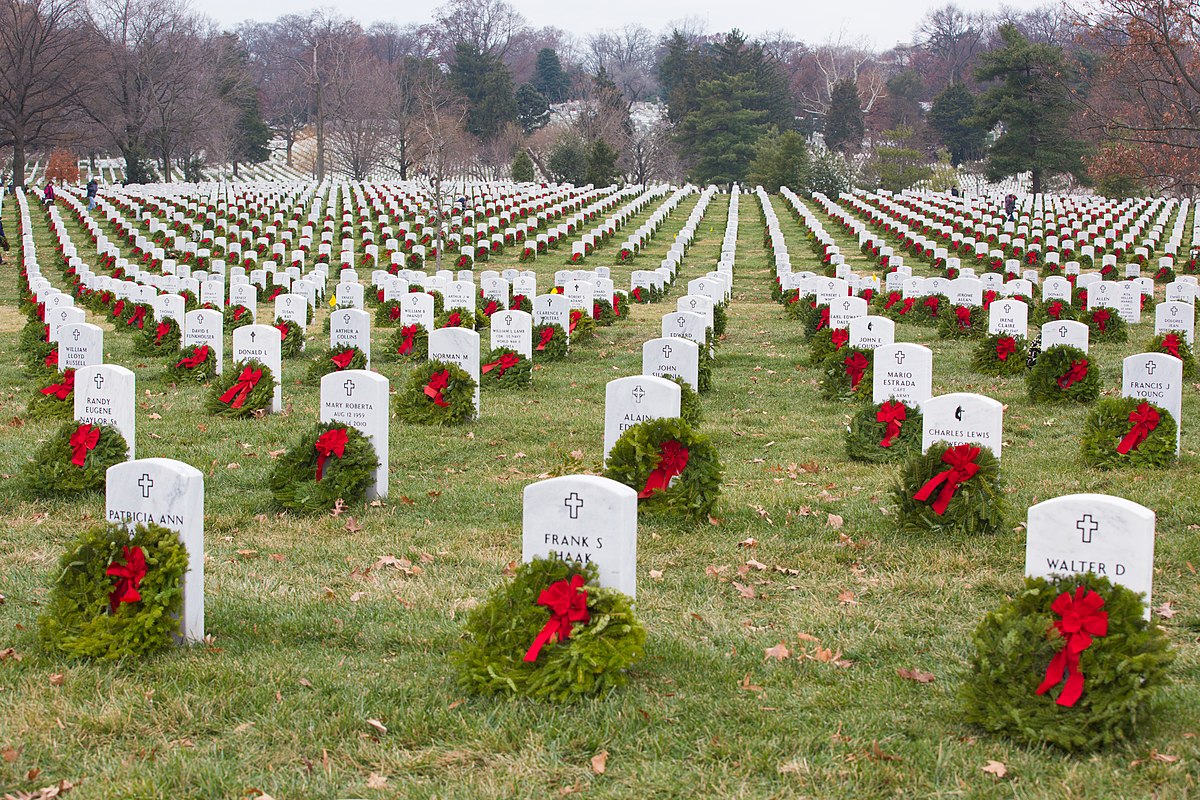 wreaths on headstones in veteran cemetery