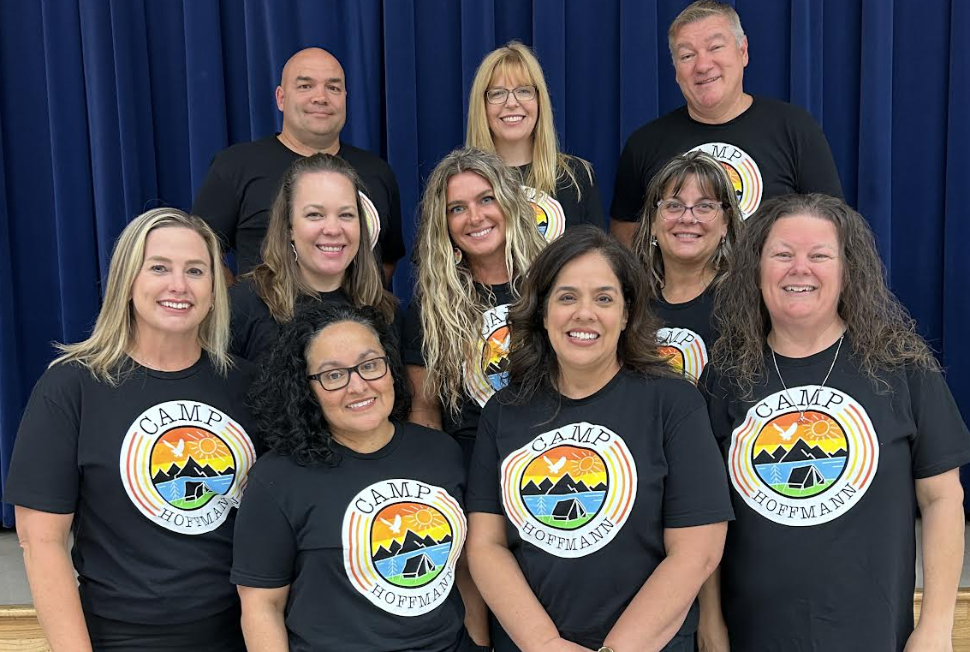 Casual photo of the Discovery and Specialist Team members wearing matching spirit shirts