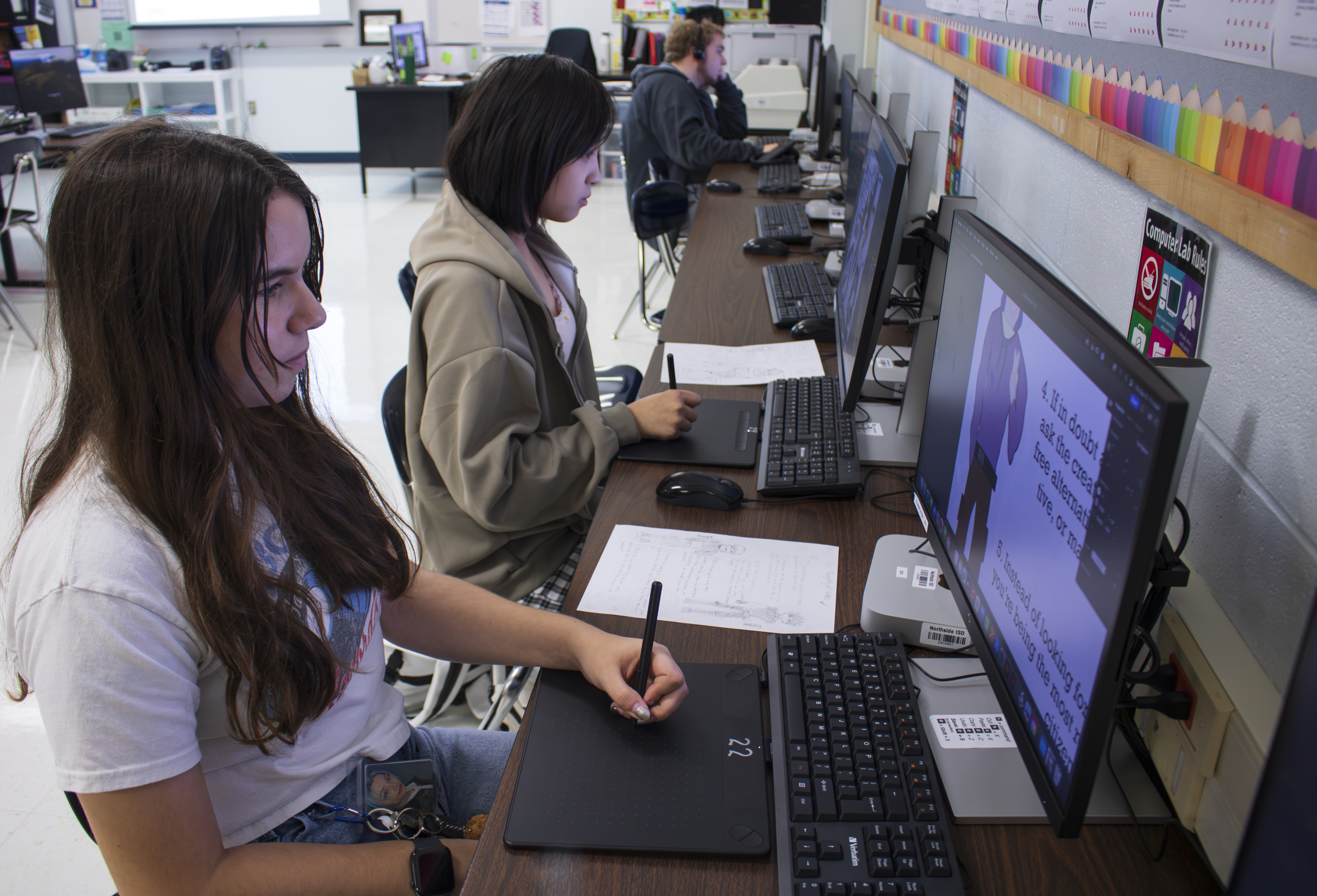 Students working with drawing tablets