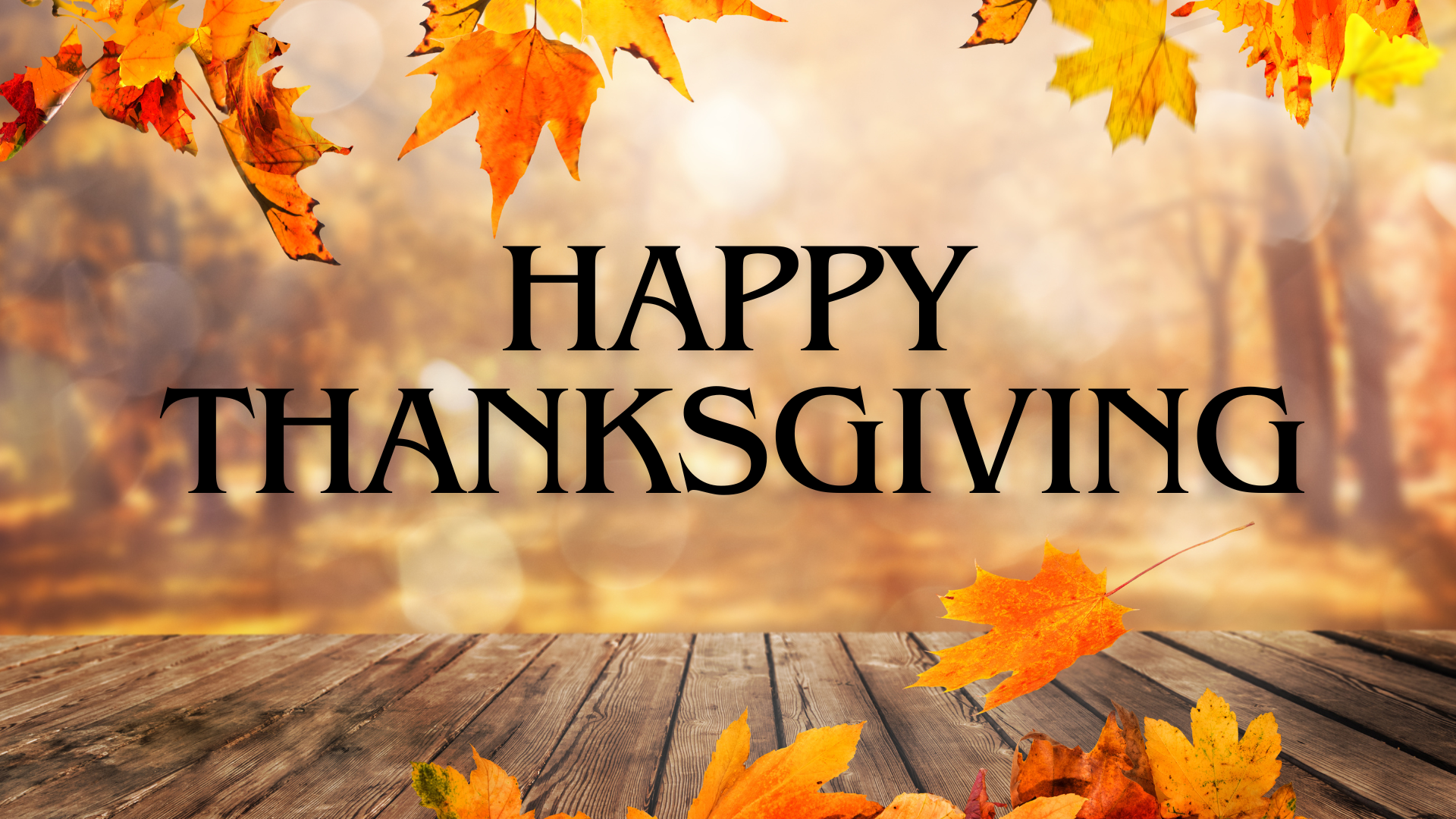 Fall poster with yellow, red and orange leaves on a brown background saying Happy Thanksgiving.