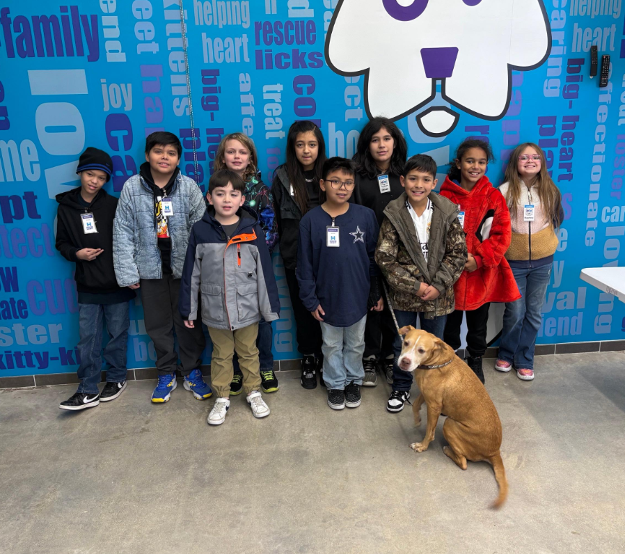 photo of students with a dog