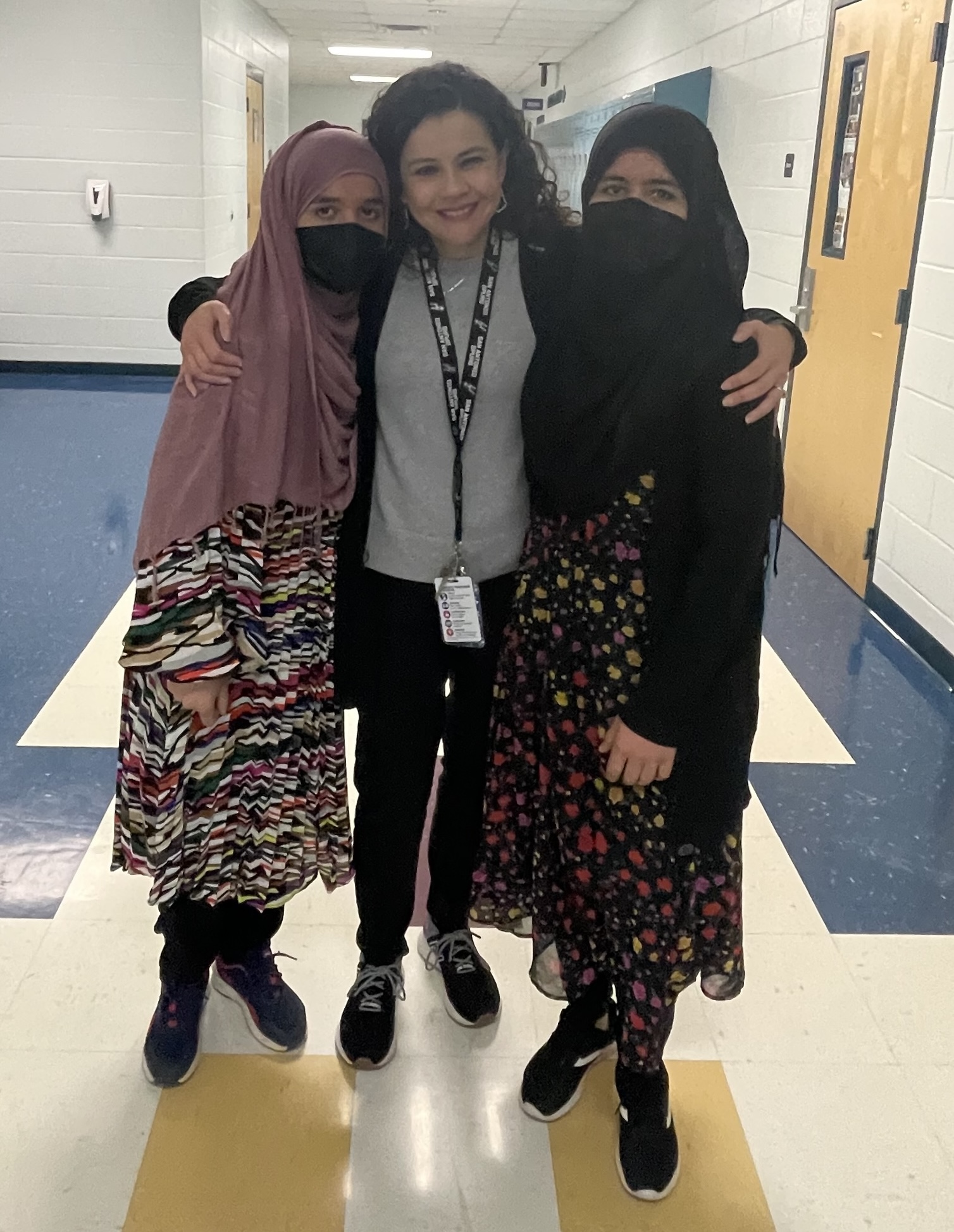 A teacher posing with students