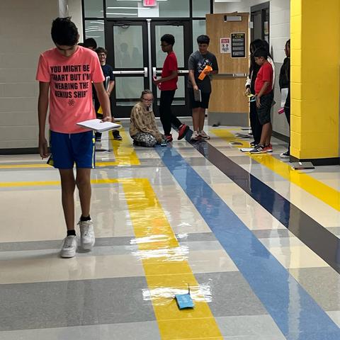 7th grade engineering students test their air skimmers.